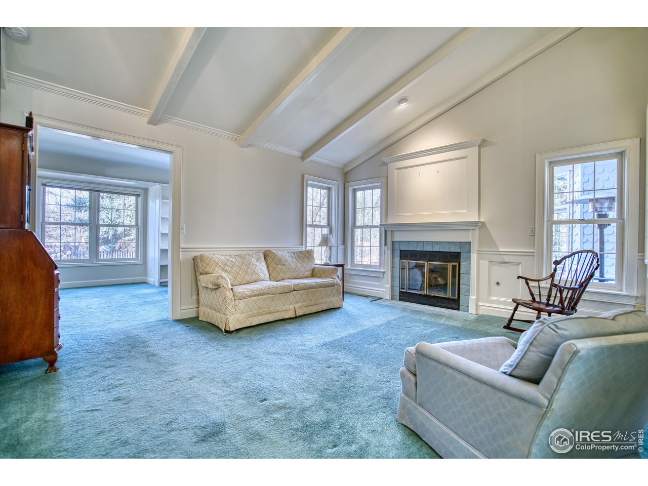 4471 Wellington Road Boulder, CO 80301 - Photo 15 of 42 a living room with furniture and a fireplace
