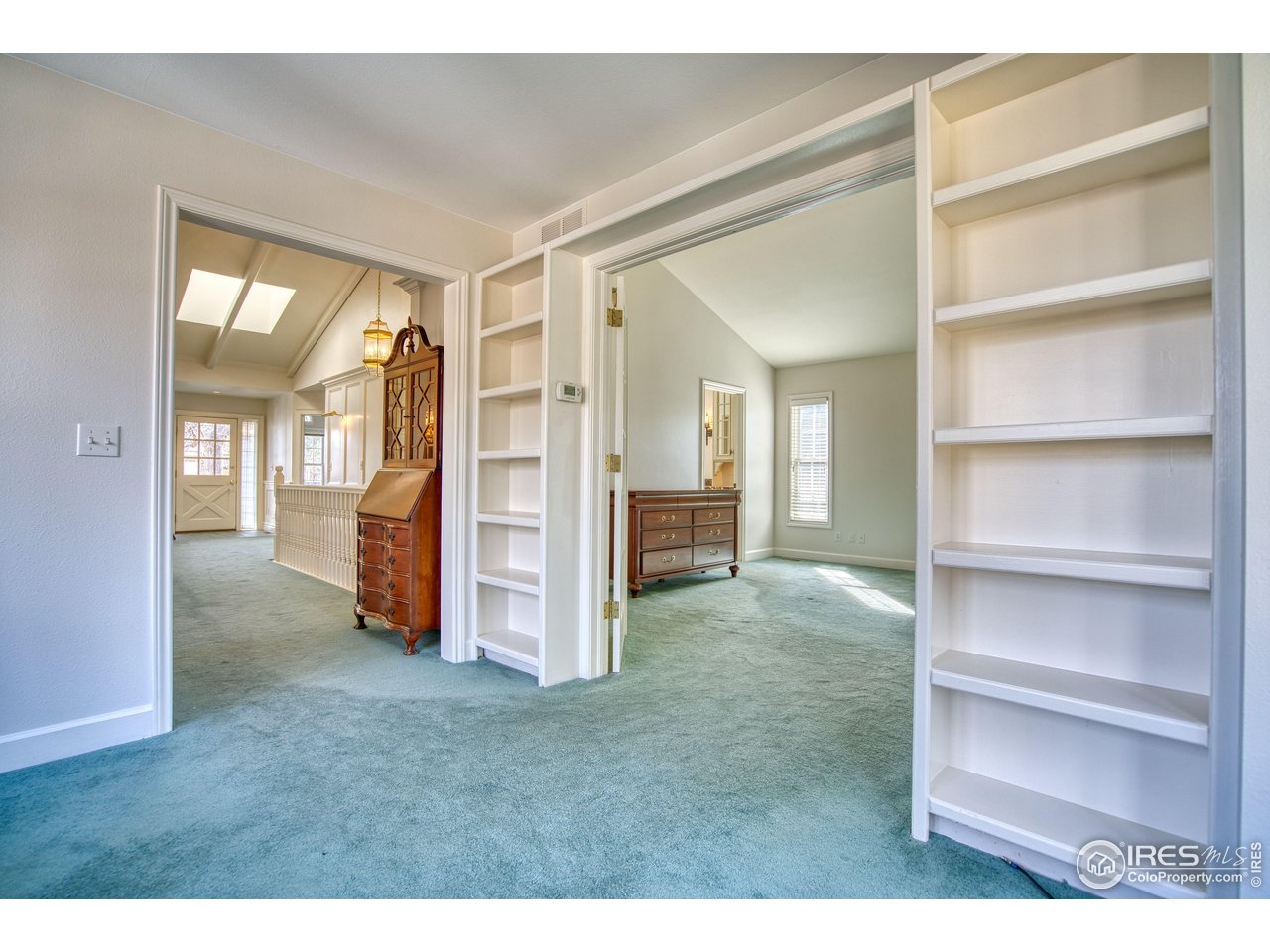 4471 Wellington Road Boulder, CO 80301 - Photo 17 of 42 a view of empty room with wooden floor and windows