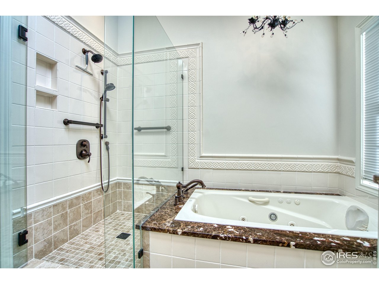 4471 Wellington Road Boulder, CO 80301 - Photo 21 of 42 a bathroom with a tub a sink and a shower
