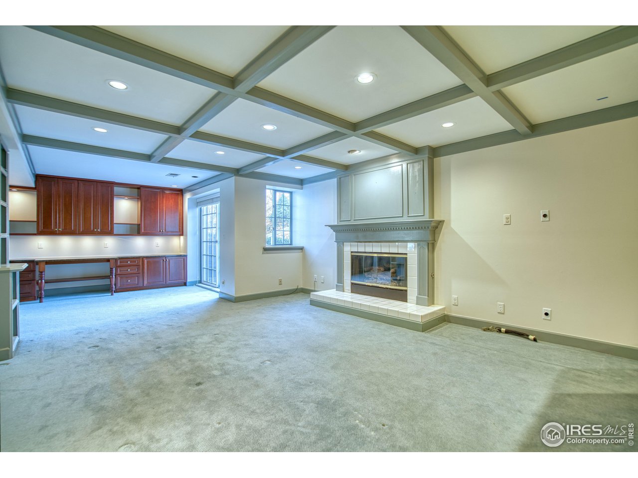 4471 Wellington Road Boulder, CO 80301 - Photo 27 of 42 a view of an empty room with a fireplace and a window