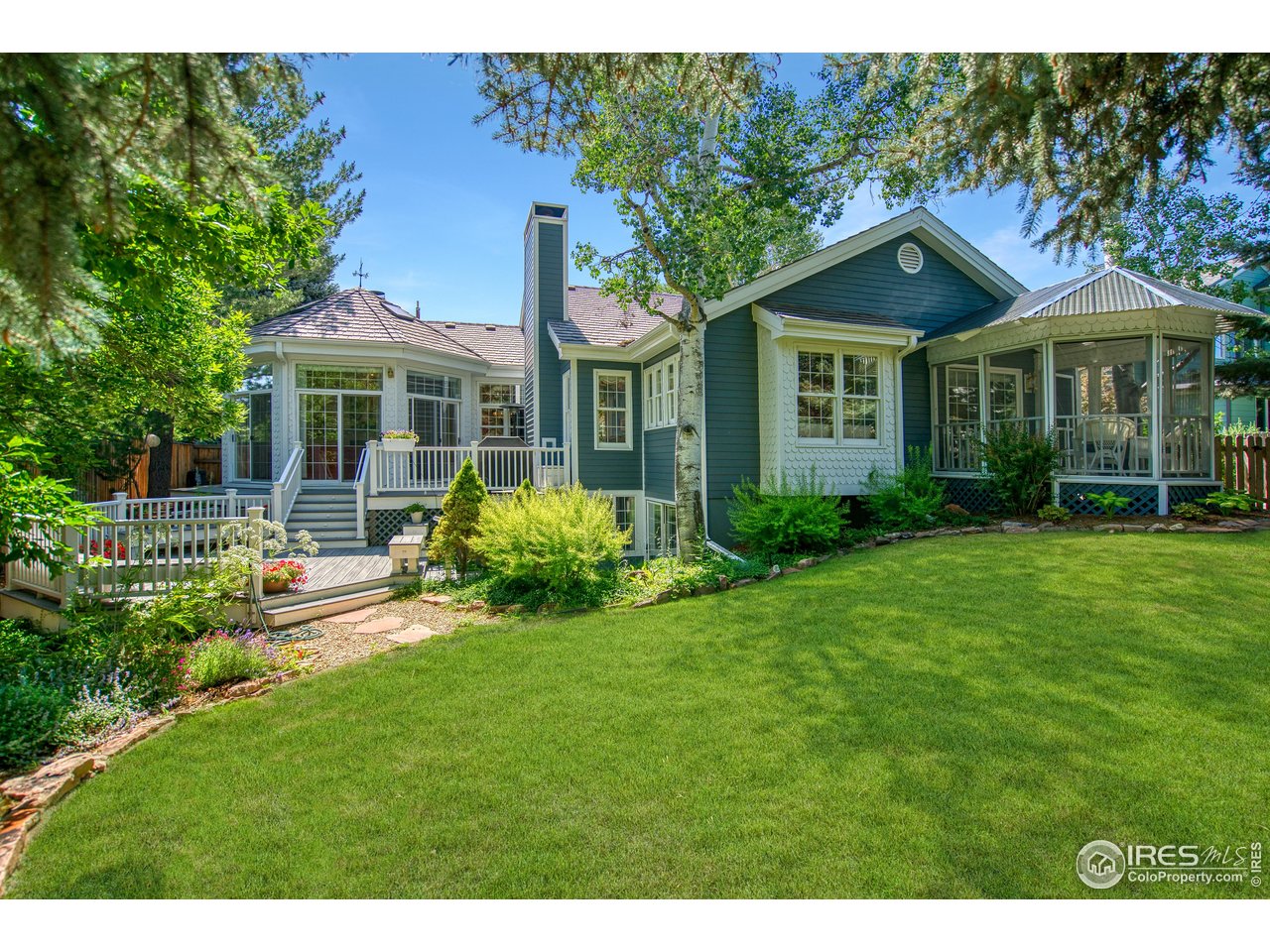 4471 Wellington Road Boulder, CO 80301 - Photo 37 of 42 a front view of a house with a yard