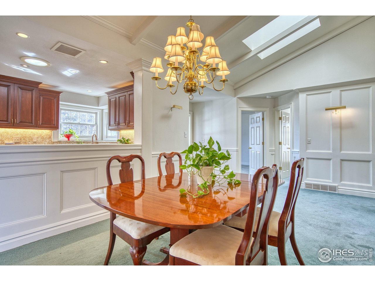 4471 Wellington Road Boulder, CO 80301 - Photo 5 of 42 a view of a dining room with furniture and chandelier