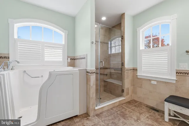 a bathroom with a bathtub and a shower
