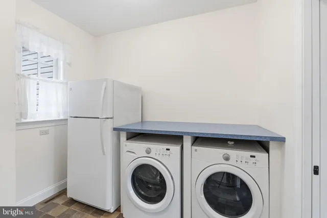 a utility room with dryer and washer