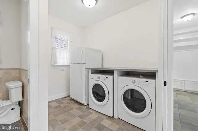 a utility room with dryer and washer