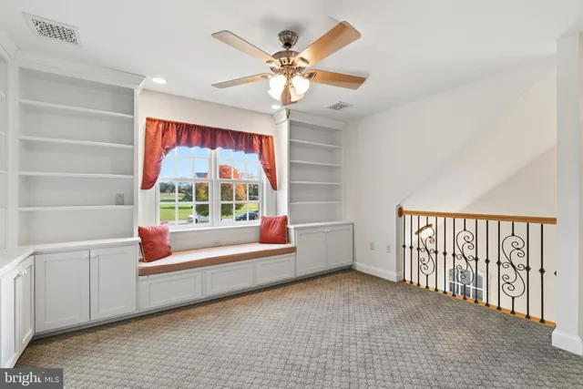 a view of entryway with an empty room and window