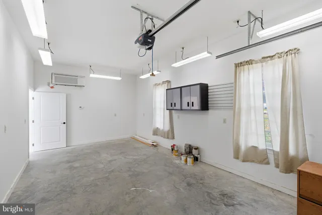 a view of a livingroom with furniture and a flat screen tv