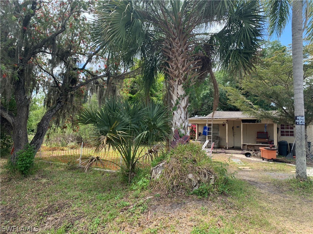7010 Watts Road Fort Myers, FL 33905 - Photo 7 of 8 a view of a yard with palm trees