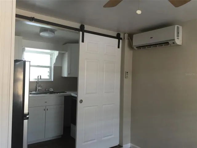 a bathroom with a shower and a sink