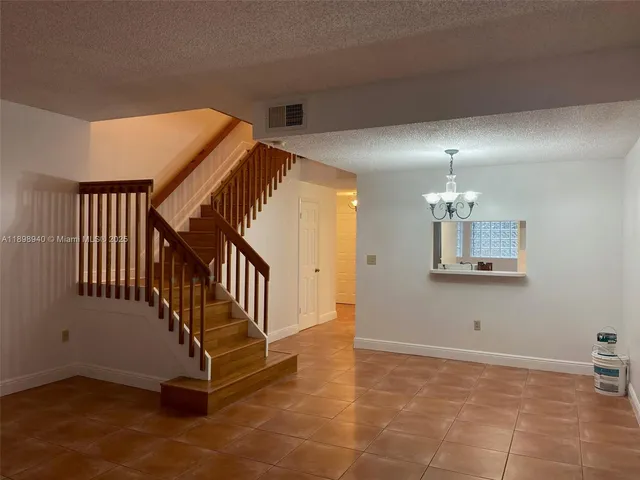 a view of a livingroom with a staircase