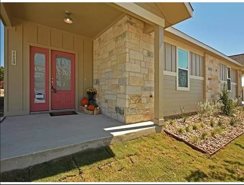 341B Rose Drive, Unit A Dripping Springs, TX 78620 - Photo 1 of 1 a bathroom with a granite countertop sink and a shower
