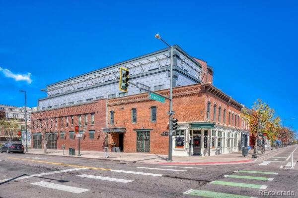 2101 Larimer Street, Unit 303 Denver, CO 80205 - Photo 1 of 21 a view of a building with a street