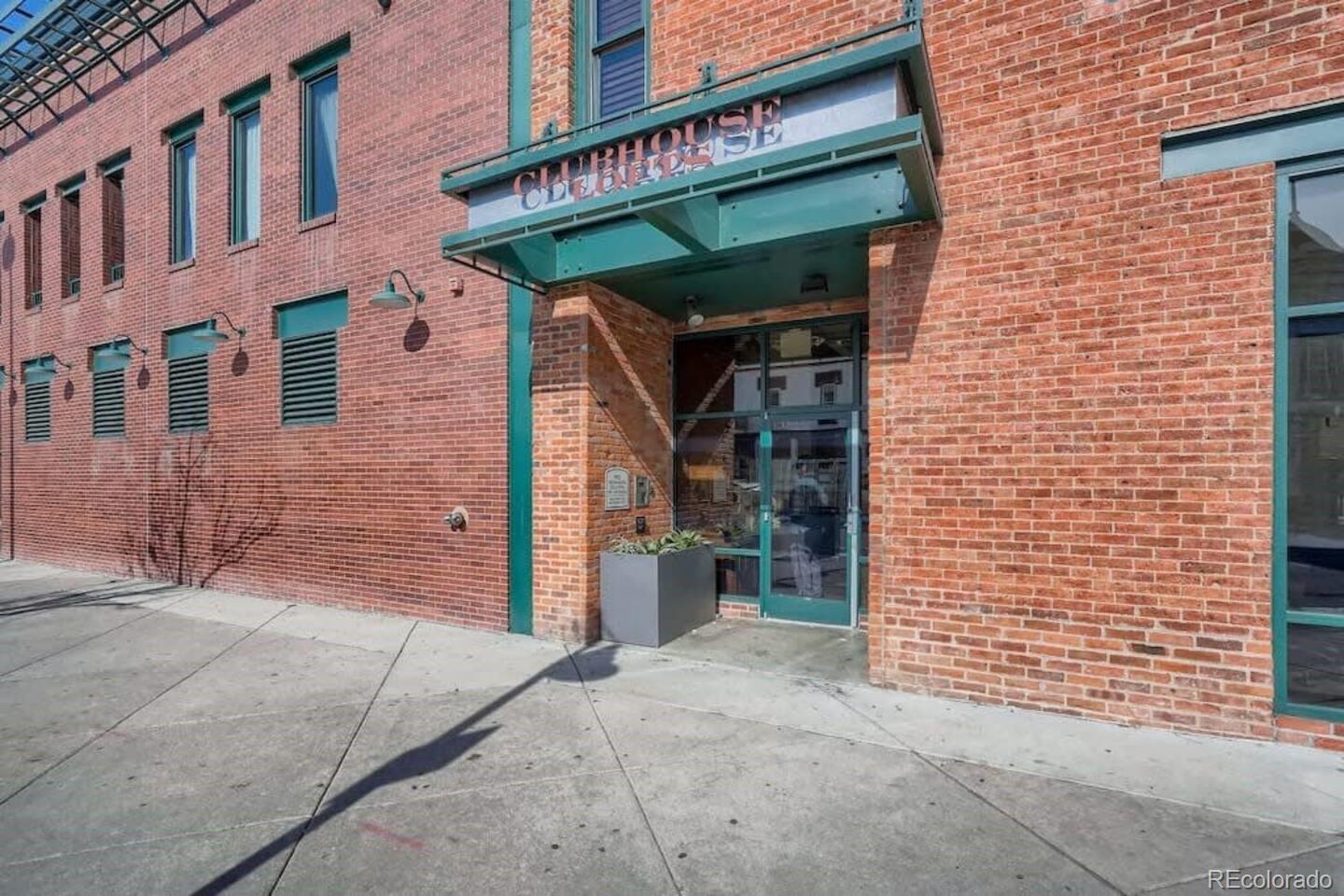 2101 Larimer Street, Unit 303 Denver, CO 80205 - Photo 2 of 21 a view of a brick house with large windows