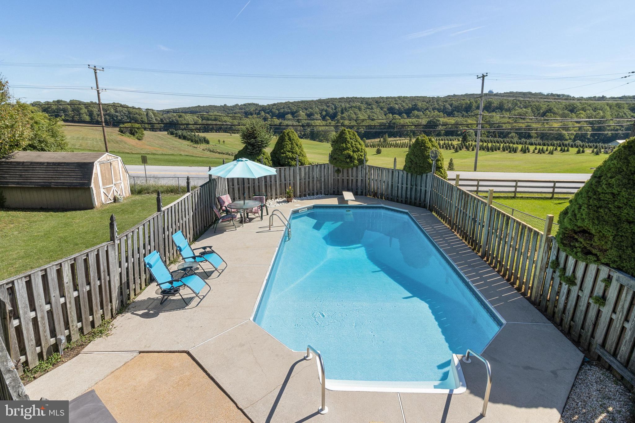 3447 Augusta Road Manchester, MD 21102 - Photo 38 of 41 Sparkling In-Ground Pool with concrete patio!