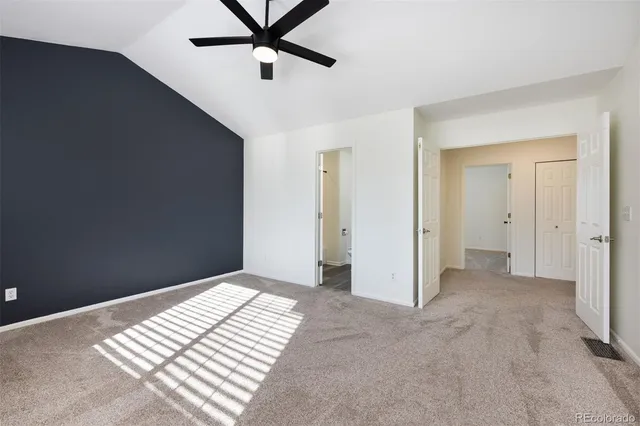 a view of an empty room and wooden floor