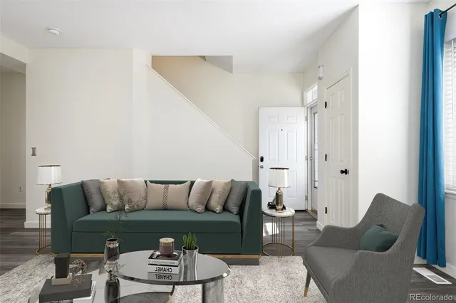 a living room with furniture and a rug