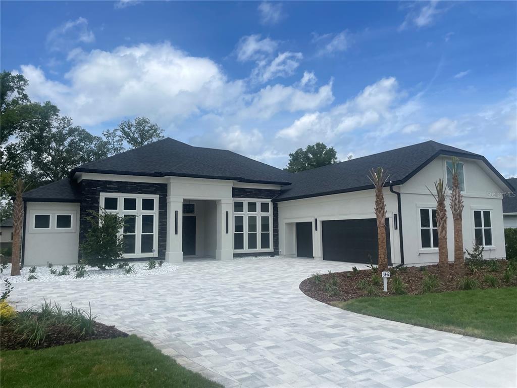 3442 Southwest 105th Street Gainesville, FL 32608 - Photo 1 of 1 front view of a house with a yard