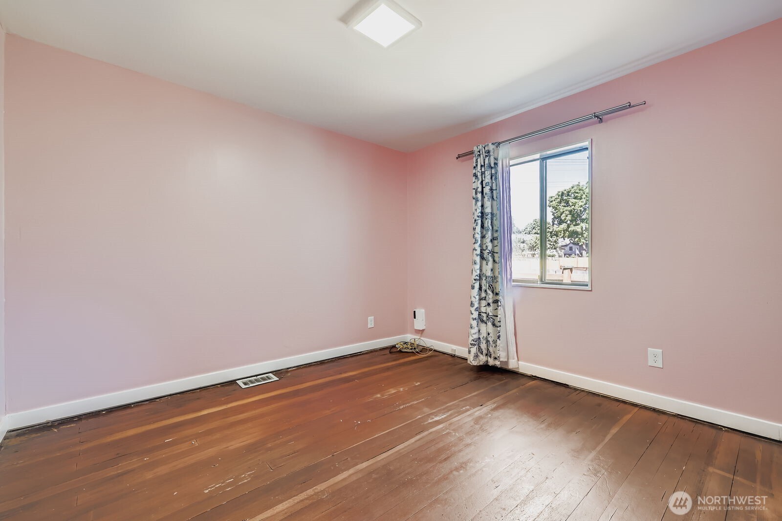 7806 Beverly Boulevard Everett, WA 98203 - Photo 14 of 22 an empty room with wooden floor and windows