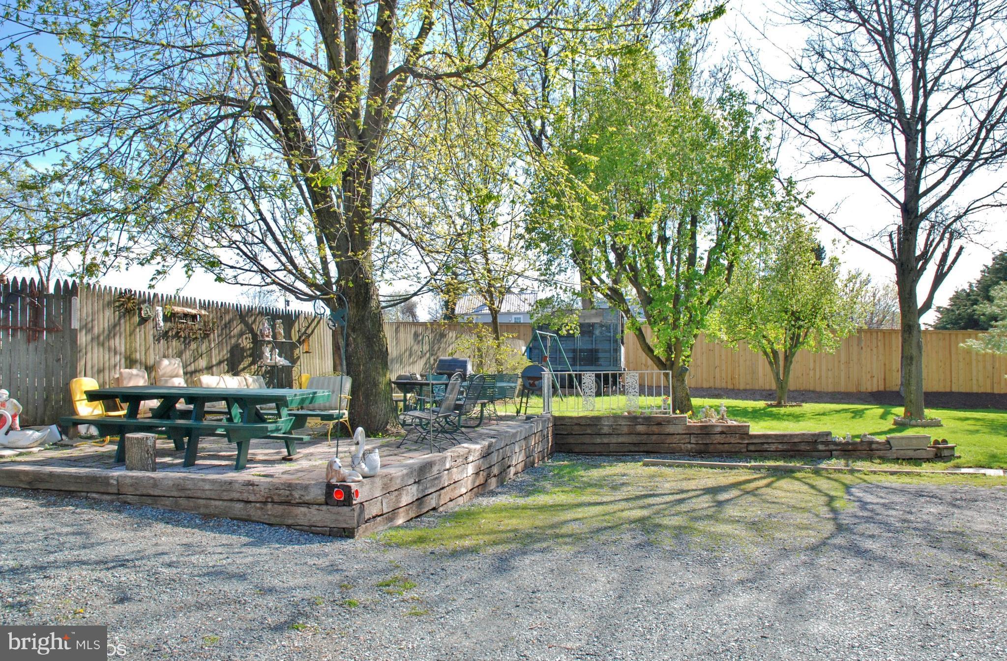 24211 Ridge Road Damascus, MD 20872 - Photo 10 of 15 Spacious Patio under the Tree