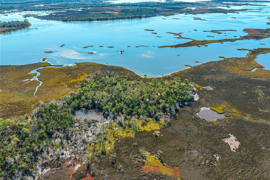 Clark Island Cedar Key, FL 32625 - Photo 14 of 46 a view of a lake with a mountain