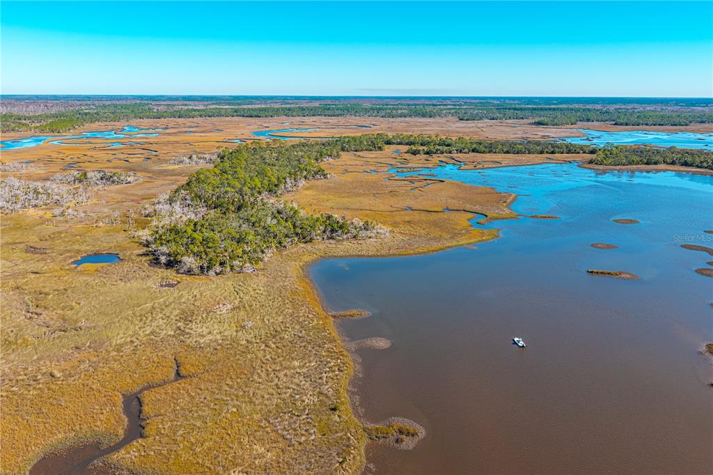 Clark Island Cedar Key, FL 32625 - Photo 18 of 46 a view of an ocean and beach