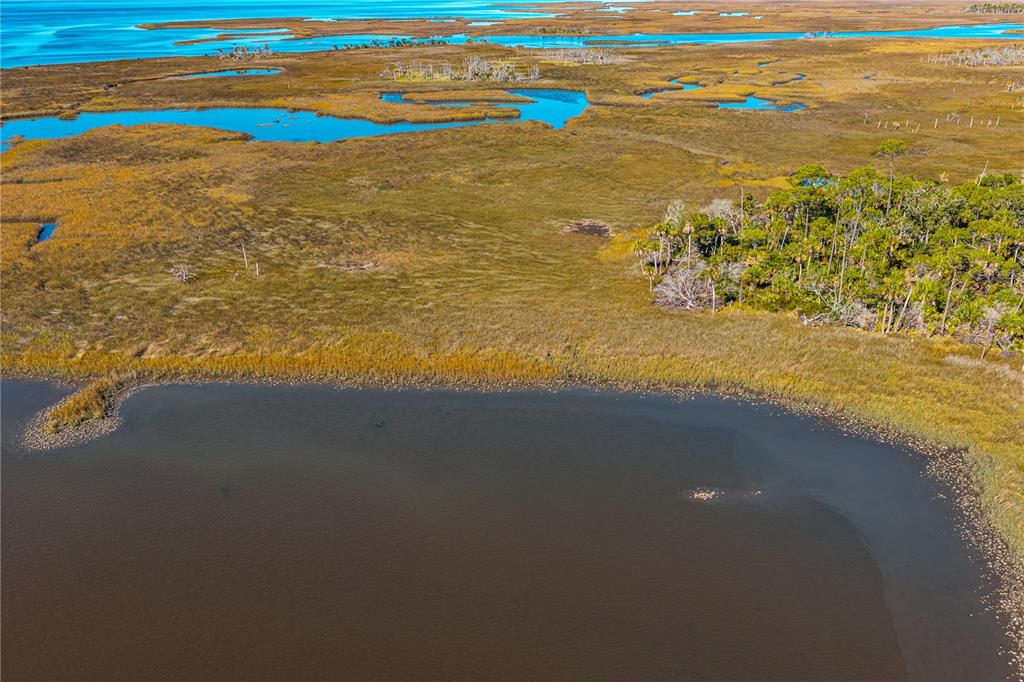 Clark Island Cedar Key, FL 32625 - Photo 32 of 46 a view of an ocean and beach