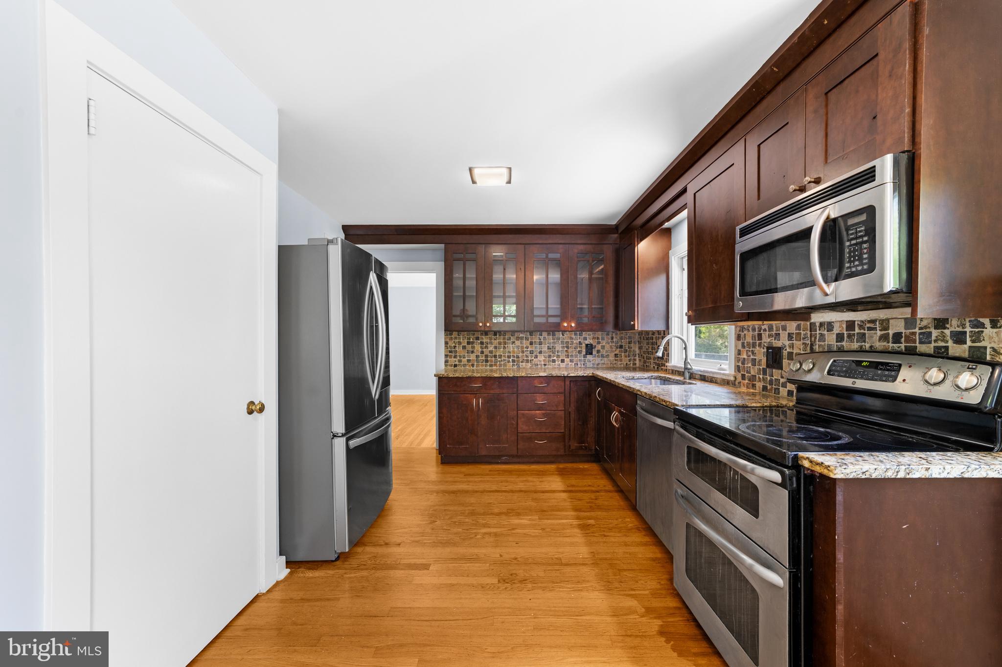 638 Princeton Kingston Road Princeton, NJ 08540 - Photo 11 of 35 a large kitchen with stainless steel appliances granite countertop a refrigerator a stove top oven a sink and dishwasher