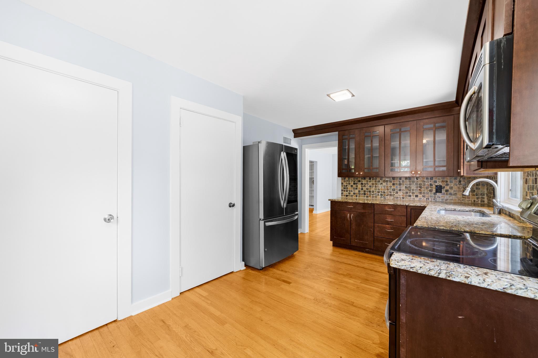 638 Princeton Kingston Road Princeton, NJ 08540 - Photo 13 of 35 a kitchen with granite countertop a sink stove and refrigerator