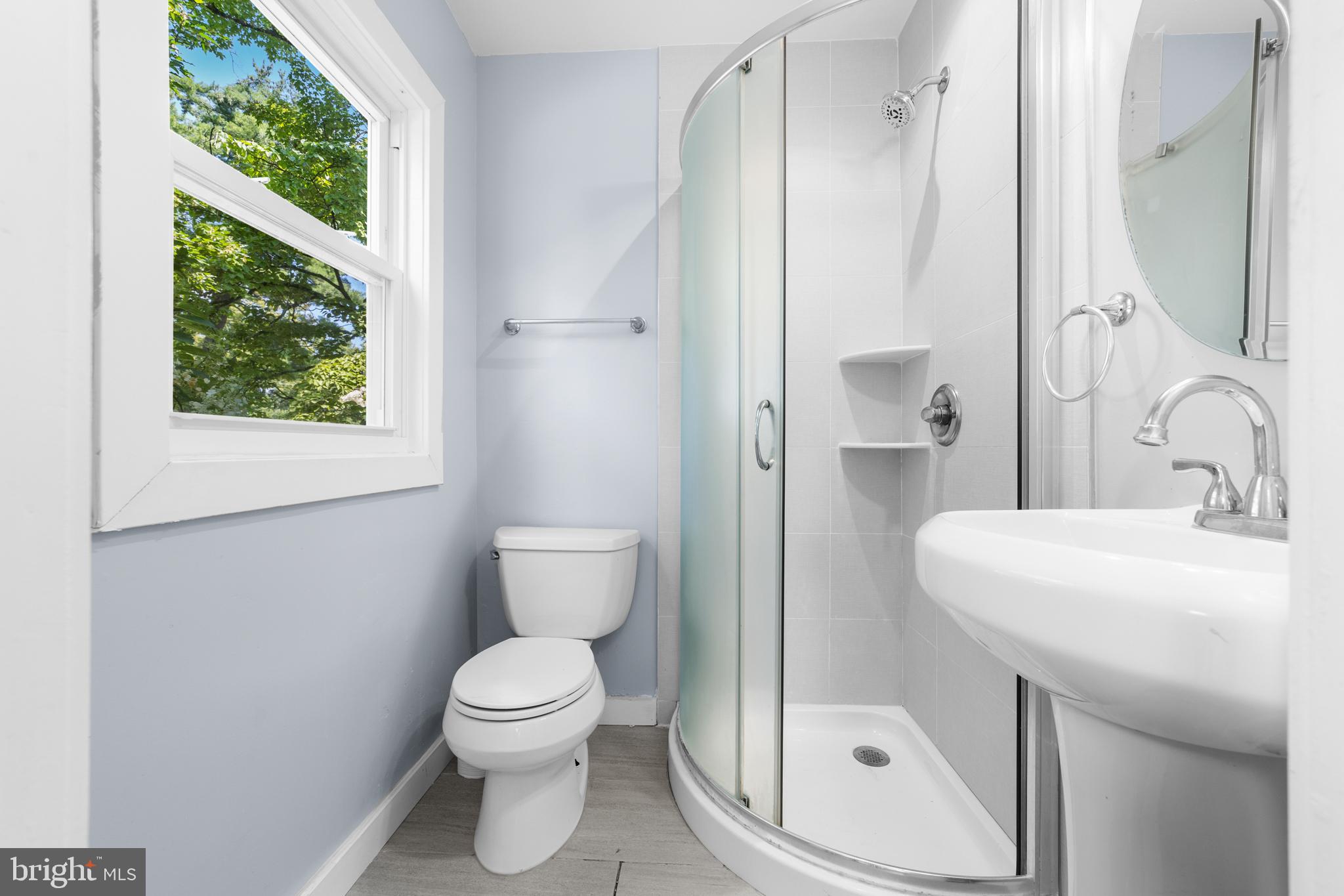 638 Princeton Kingston Road Princeton, NJ 08540 - Photo 21 of 35 a bathroom with a toilet a sink and a mirror