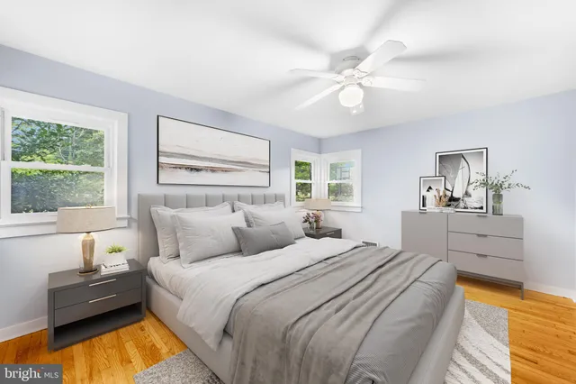 a living room with furniture fireplace and window