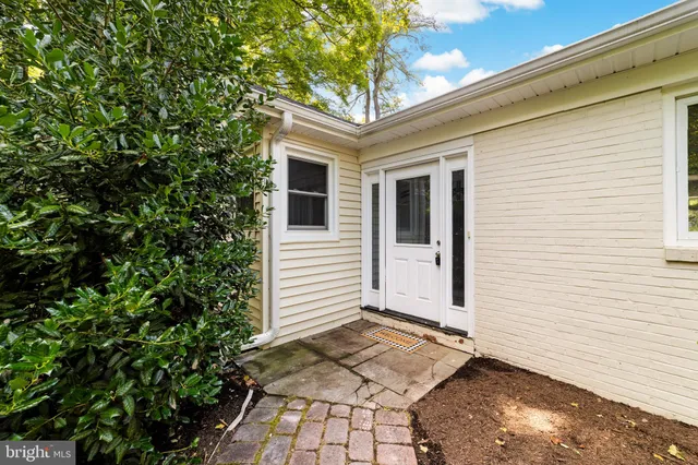 a view of house with backyard