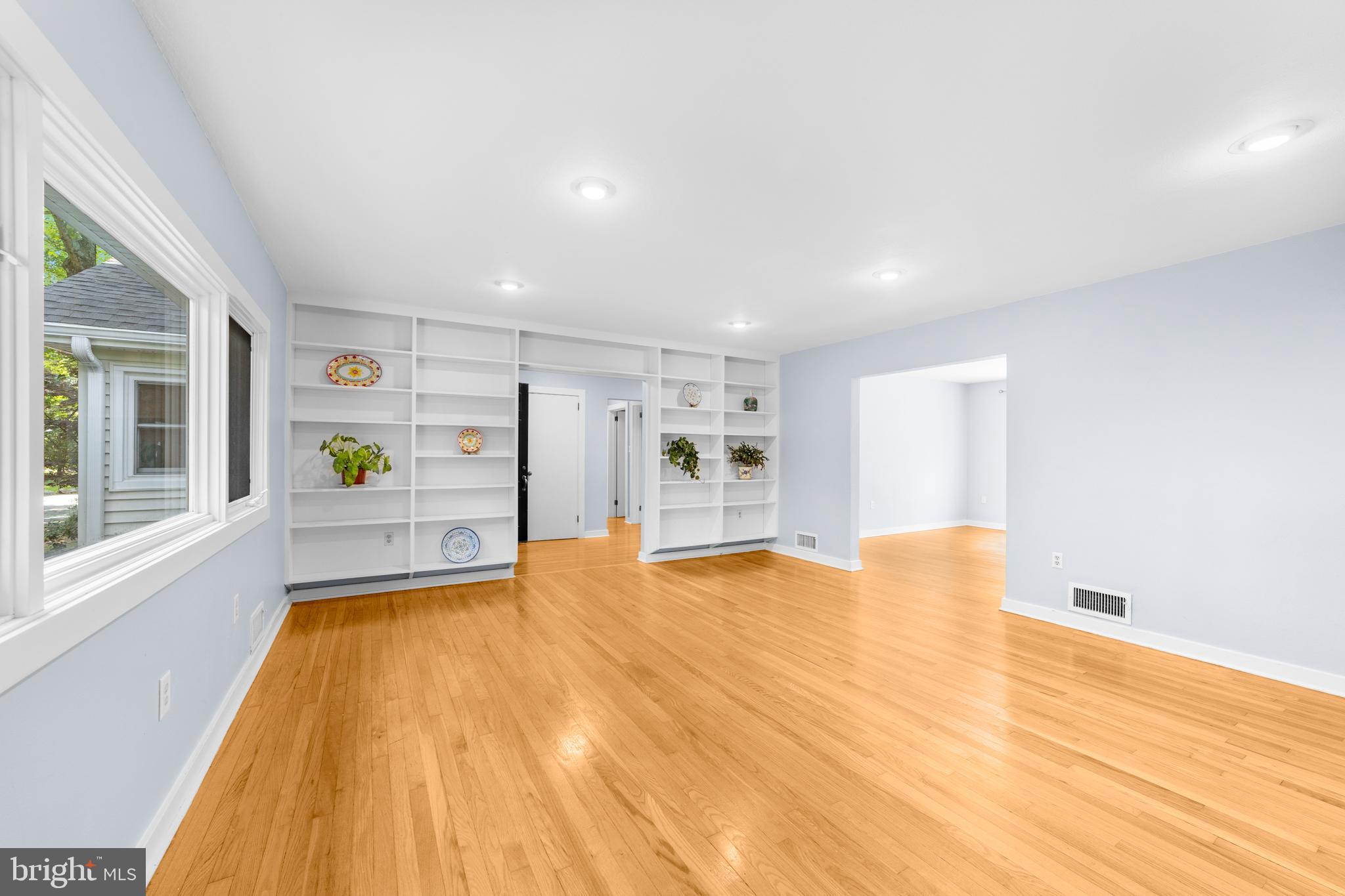 638 Princeton Kingston Road Princeton, NJ 08540 - Photo 7 of 35 a view of an empty room with window and wooden floor
