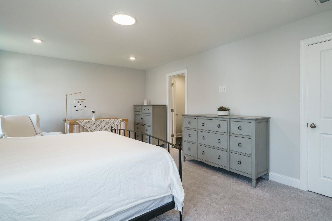 136 Rostova Way Holly Springs, NC 27540 - Photo 24 of 42 Primary Bedroom