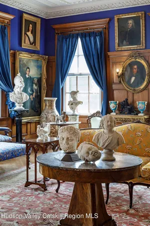 a living room with granite countertop furniture a rug and a window