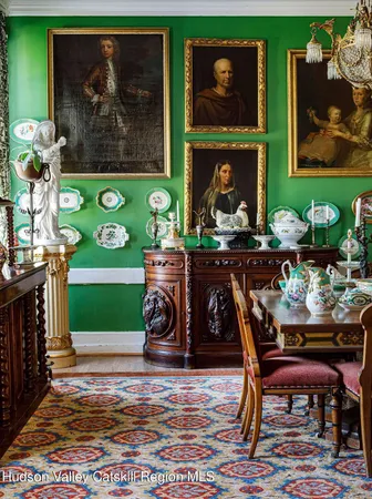 a view of a dining room with furniture and a rug