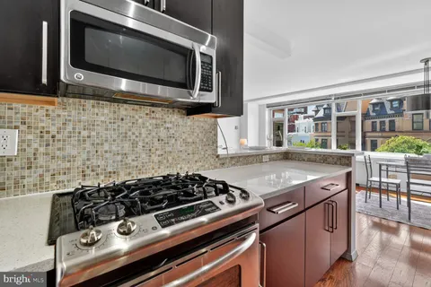 a kitchen with a stove and a microwave