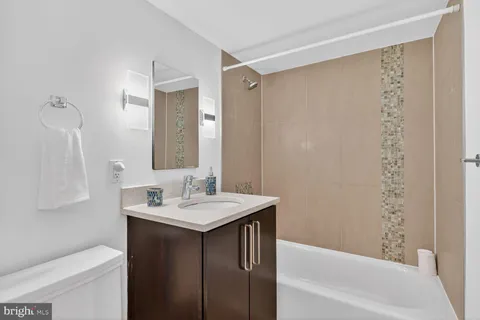 a bathroom with a sink a toilet and a bathtub