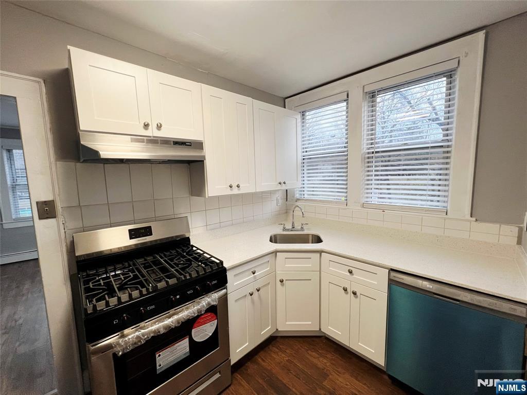 419 Plainfield Avenue Berkeley Heights, NJ 07922 - Photo 4 of 9 a kitchen with stainless steel appliances a sink stove and cabinets