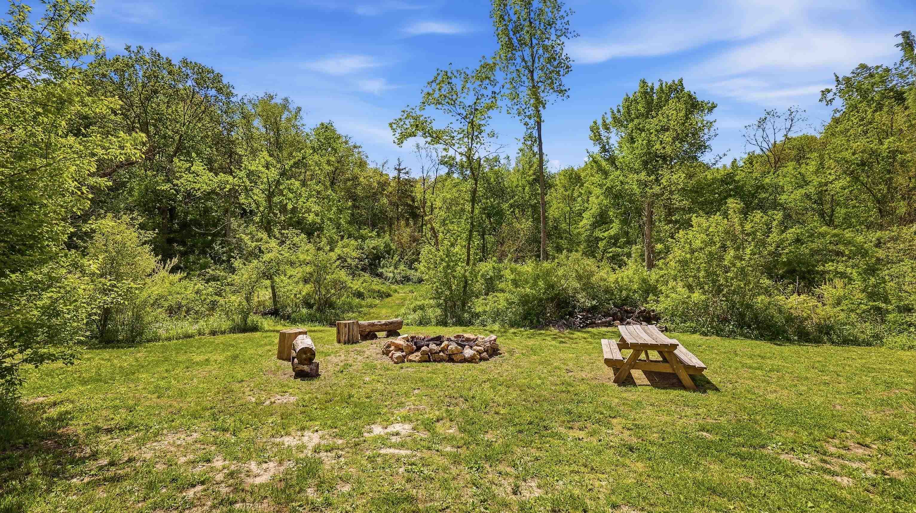 2562 West Blackjack Road Galena, IL 61036 - Photo 70 of 75 a backyard of a house with table and chairs