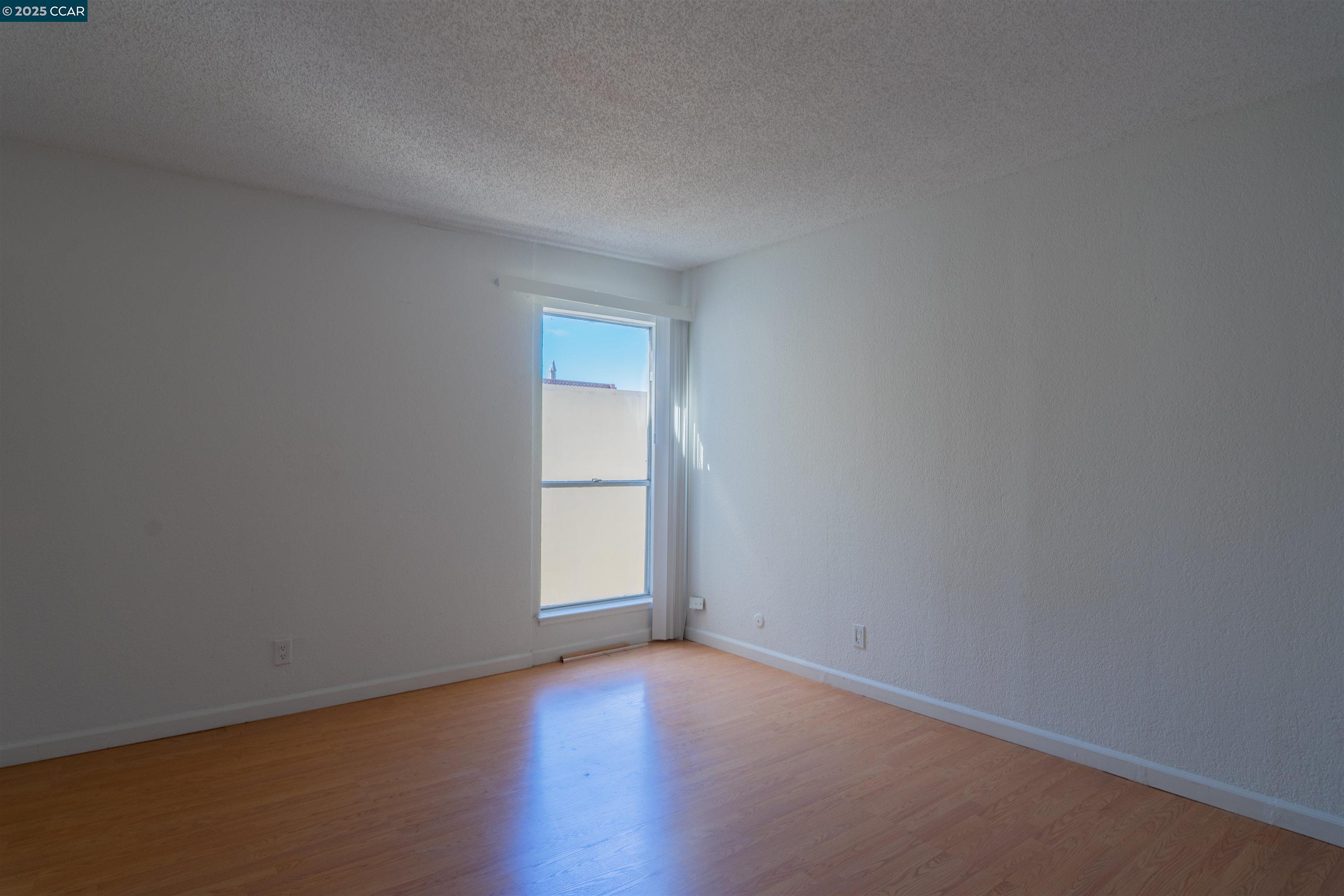 466 Crescent Street, Unit 306 Oakland, CA 94610 - Photo 19 of 26 a view of empty room with window