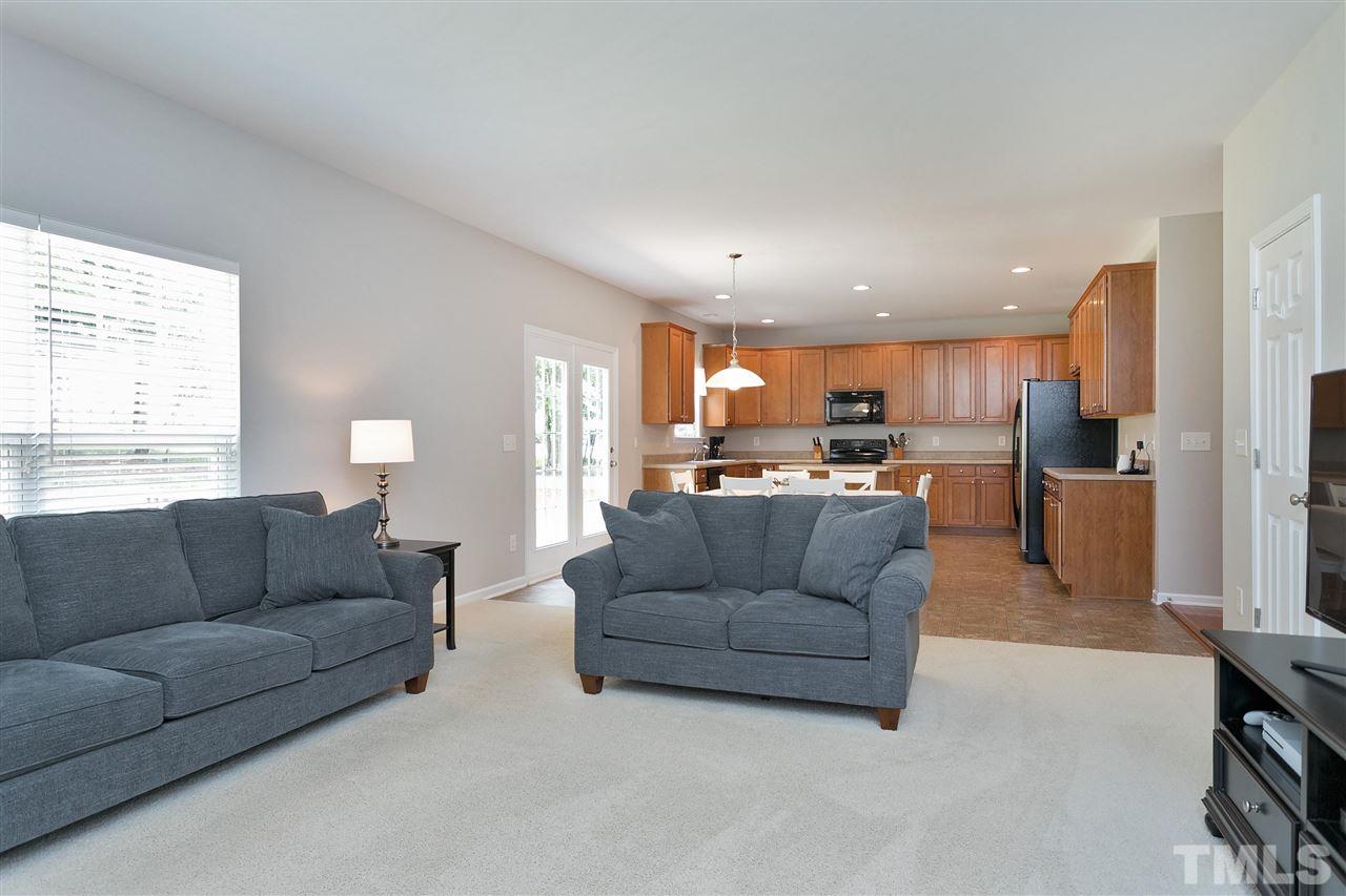 118 Key Biscayne Court Raleigh, NC 27603 - Photo 12 of 30 a living room with furniture and kitchen view