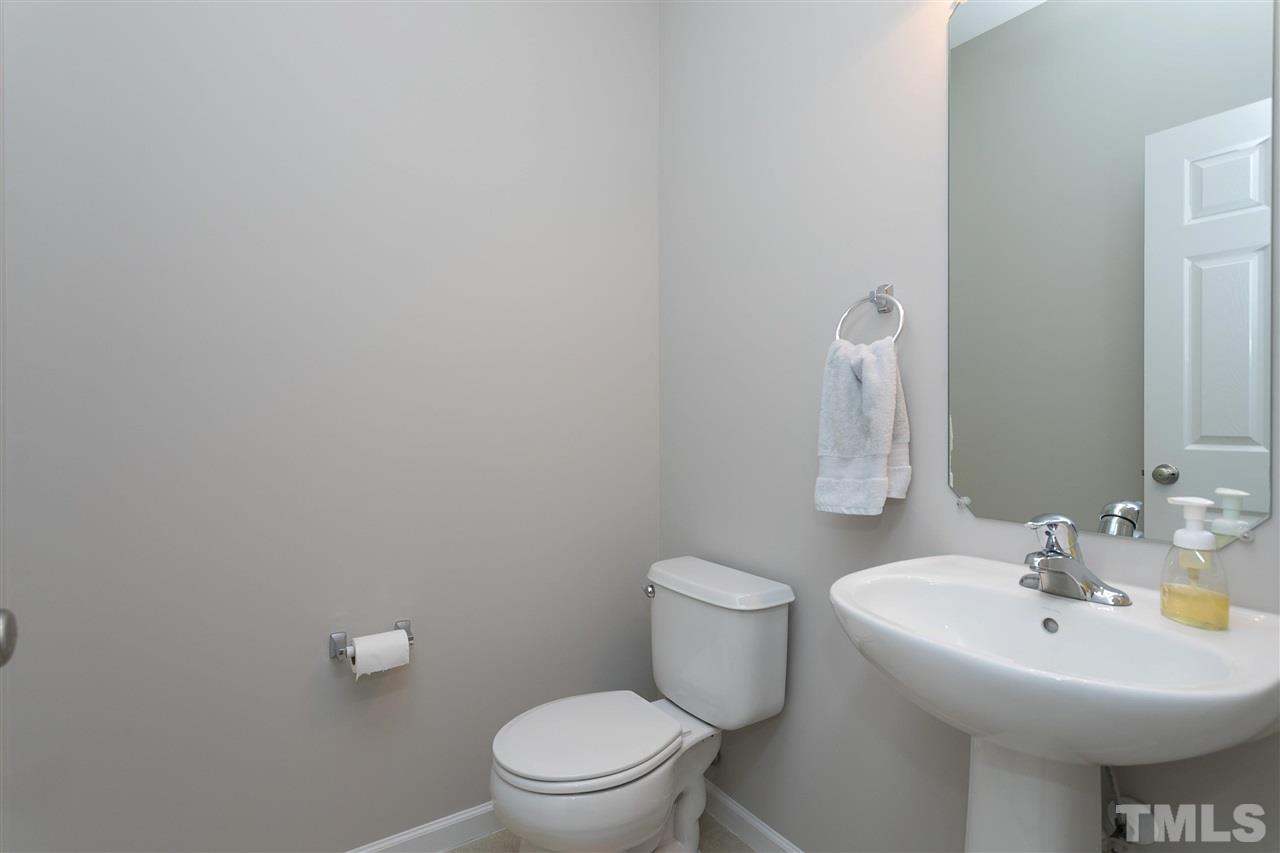 118 Key Biscayne Court Raleigh, NC 27603 - Photo 17 of 30 a bathroom with a sink a toilet and a mirror