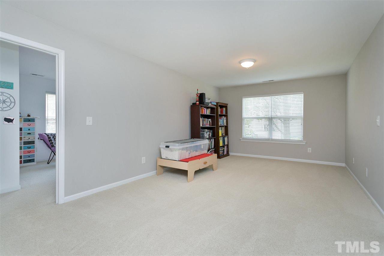 118 Key Biscayne Court Raleigh, NC 27603 - Photo 18 of 30 an empty room with toys and air conditioner vent