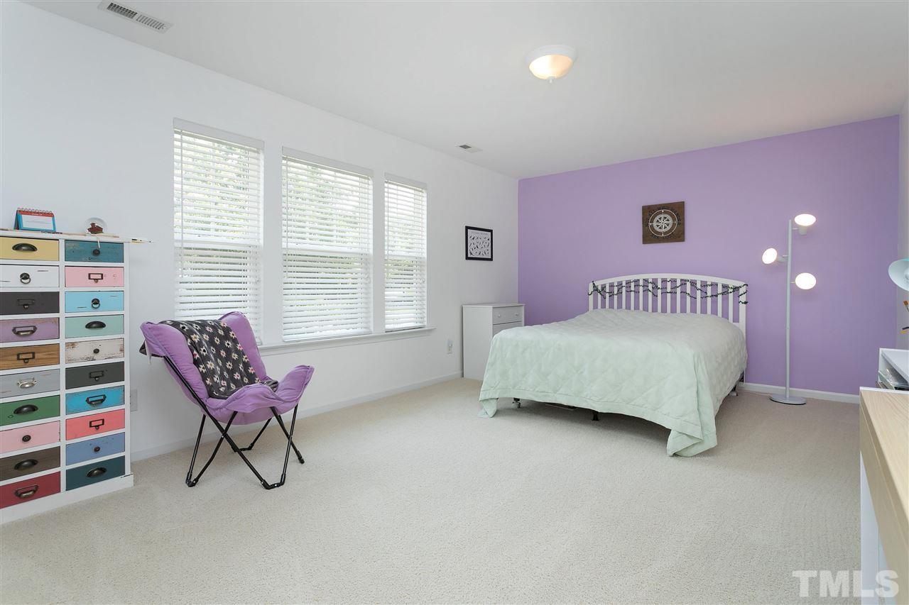118 Key Biscayne Court Raleigh, NC 27603 - Photo 23 of 30 a bedroom with a bed chair and window