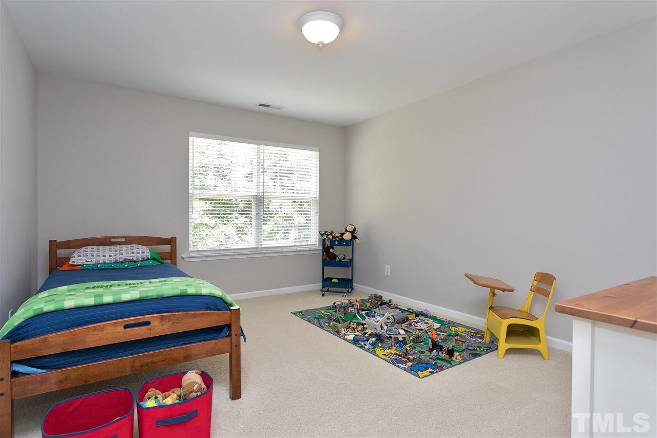 118 Key Biscayne Court Raleigh, NC 27603 - Photo 26 of 30 a bedroom with furniture and a window