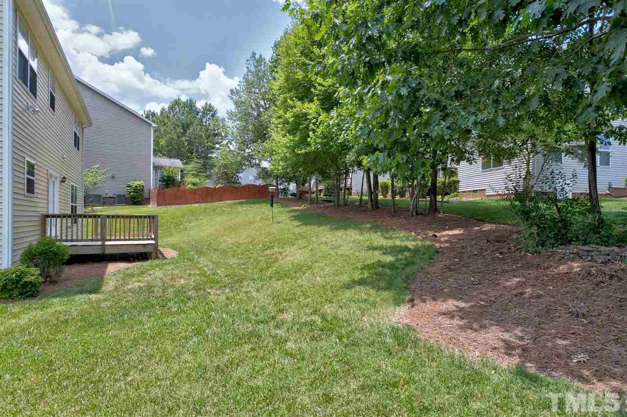 118 Key Biscayne Court Raleigh, NC 27603 - Photo 29 of 30 a view of a backyard with large trees