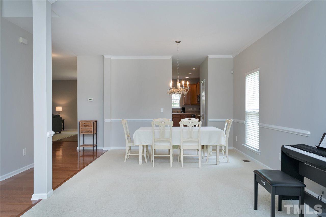 118 Key Biscayne Court Raleigh, NC 27603 - Photo 6 of 30 a view of a dining room with furniture