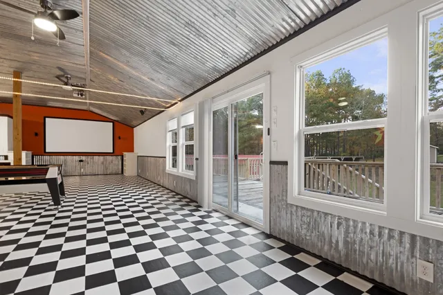 a hallway with a black white checkered floor