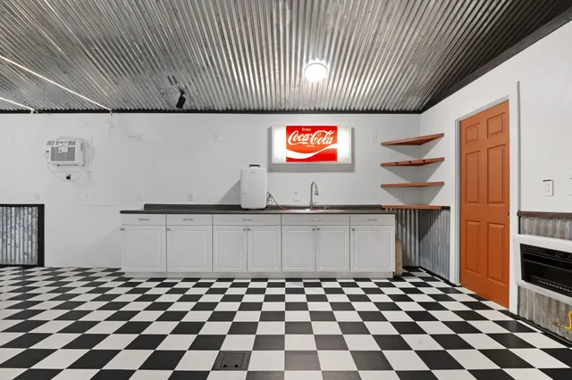 a room with a black white checkered floor