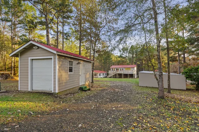 a view of a house with a yard and garage